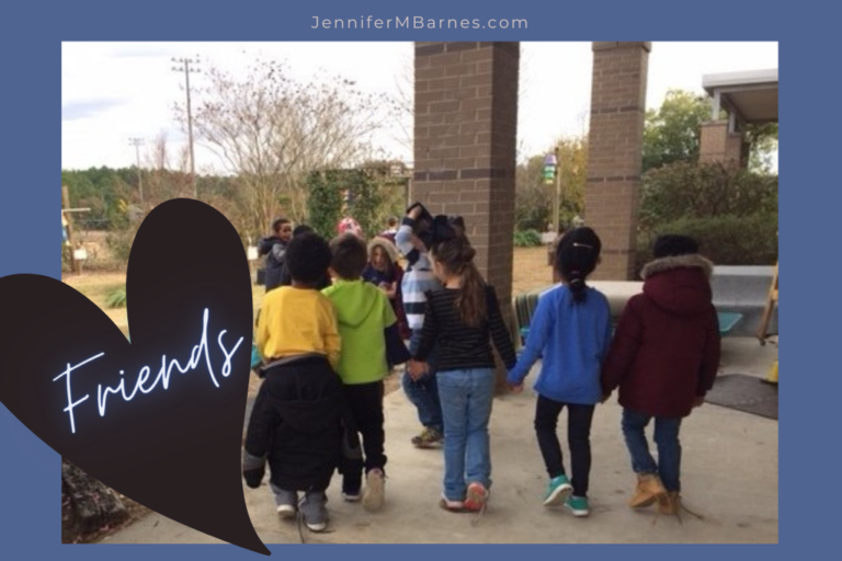 Image features a small group of children walking happily through a garden, holding hands, with the caption "friends."