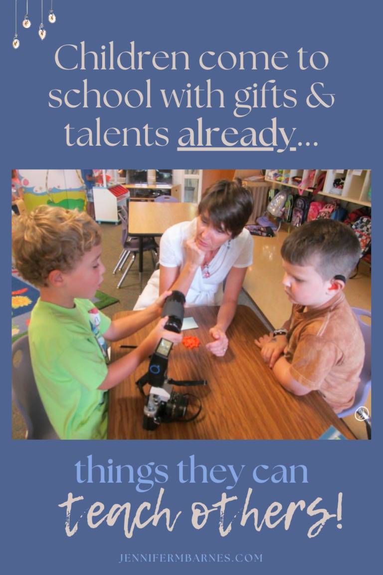 Image of a child holding a camera and talking to a teacher and another student. Caption says, "Children come to school with gifts and talents already - things they can teach others!"