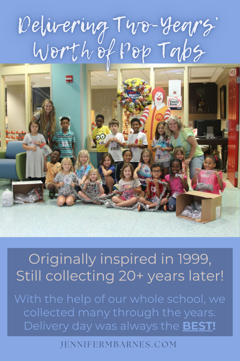 Image of a class photograph taken with a Ronald McDonald poster at the Ronald McDonald room in a children's hospital. The children have chains and boxes of pop tabs to donate to the mission.