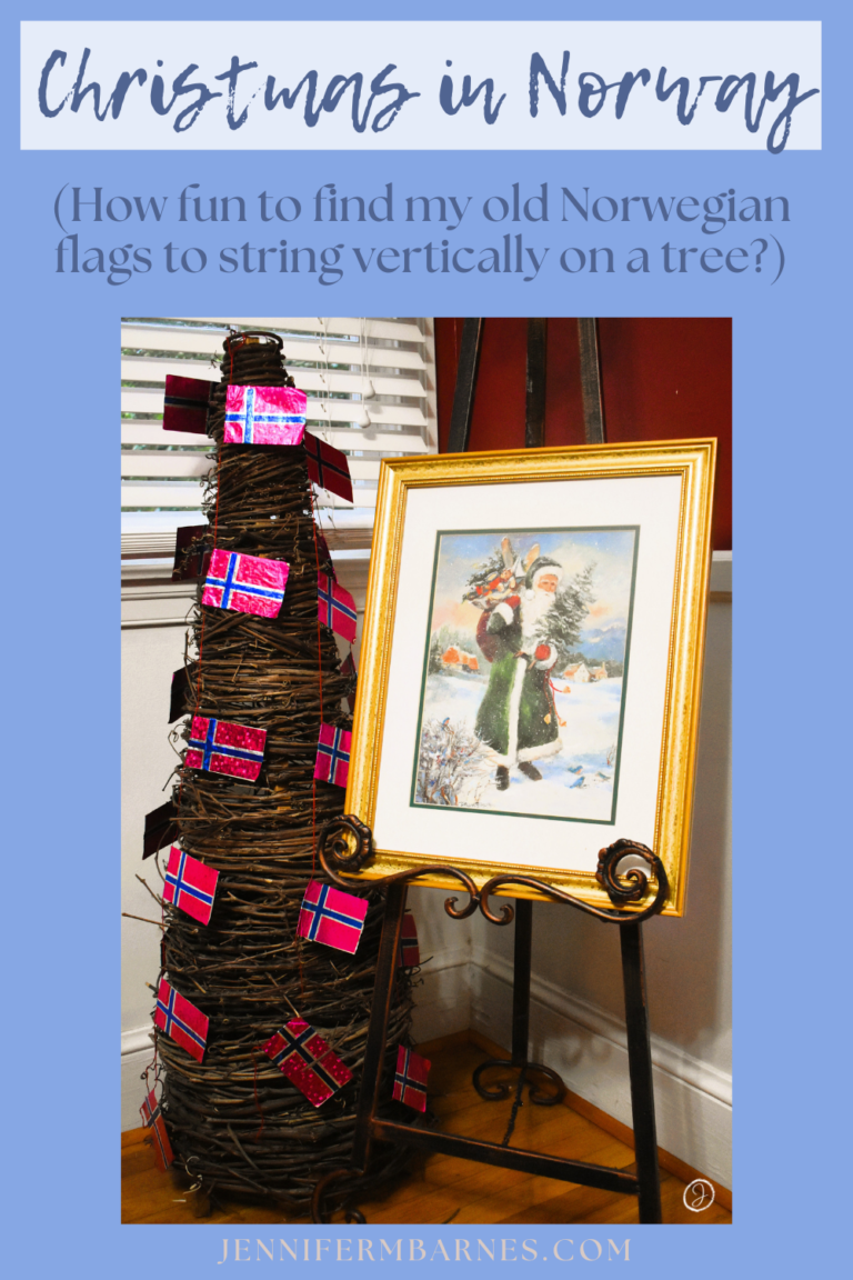 A Christmas tree featuring miniature Norwegian flags strung vertically up and down the tree